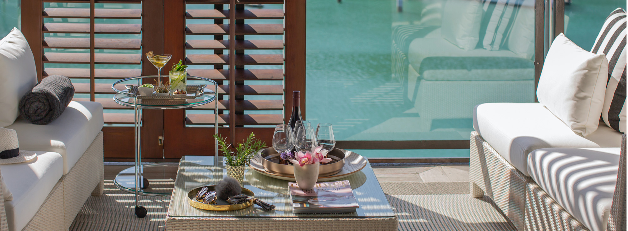 Seaside Terrace Summer Cocktail Aesthetic - Dedon Furniture, Tom Dixon Wine Glasses & Cashmere Throw | Point Residence Luxury