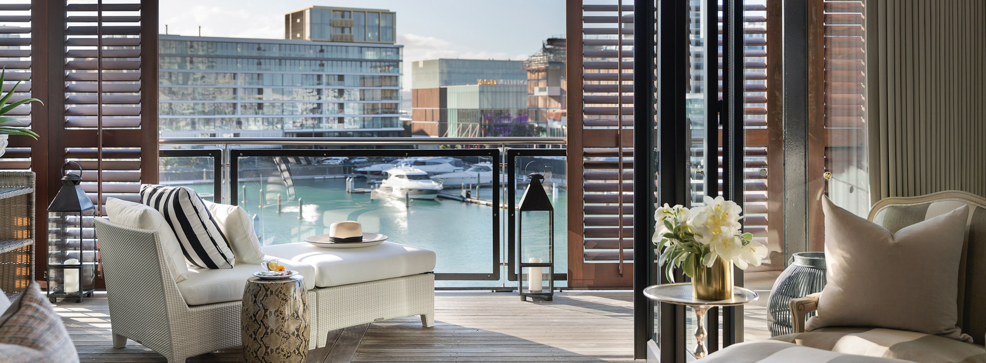 Dedon outdoor sunlounger, panama hat, lanterns, plantation shutters & harbour views | Point Residence Vacation Home for renthort term v2